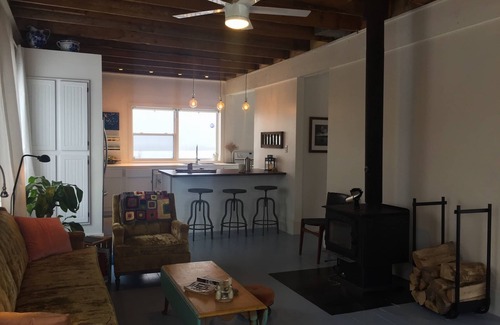 Amherst House | Modernized Waterfront Farmhouse with Wood Stove on 9 Acres of Land