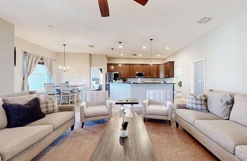 Plant City House | Modernly updated open home with lake view, screened-in patio, grill, AC, & W/D