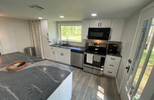 Afton House | Monkey Island Escape sleeps 8, surrounded by nature with views of Grand Lake.