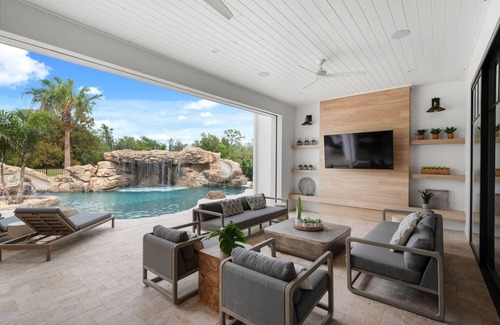 Reunion House | Morlando Three floor rocket ship, luxurious interior, back yard oasis with pool