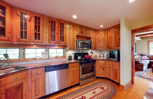 Warren House | Mountain-view house near skiing with hot tub, fireplace, balcony, & firepit
