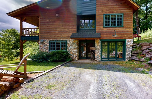 Warren House | Mountain-view house near skiing with hot tub, fireplace, balcony, & firepit