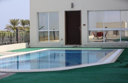 Muscat House | Muscat beach front GH