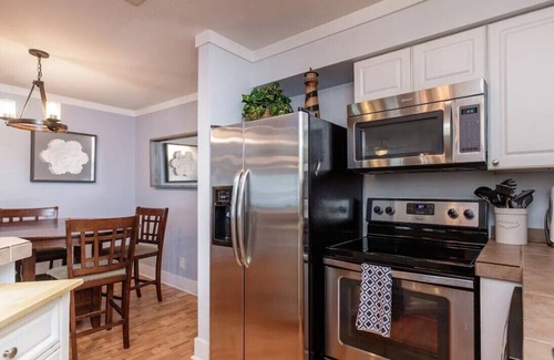 Port Aransas Condo | MUSTANG ISLAND POOLSIDE PARADISE - Boardwalk to beach, heated pool. hot tub!