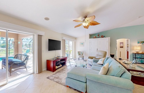 Long Meadow House | Nautical charmer on the canal with heated pool, sunny lanai, grill, W/D, and AC