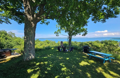 Frankfort Cottage | New! Above Crystal Lake - Hot Tub and Stunning Hilltop Views for Stargazers and Nature Lovers! Window A/C Unit in Bedroom!