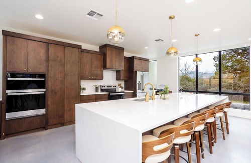 Concan House | NEW Glam Luxury Home by River! Heated Pool Hot Tub Movie Room Firepit Sleeps 24