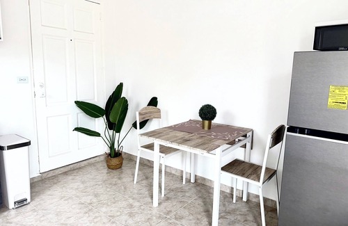 Oranjestad Apartment | New Modern 1B Apt Kitchen & TV