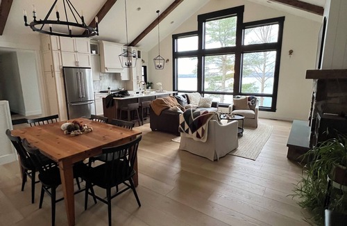 Aitkin House | New, stunning modern lake home with private swimming beach and dock