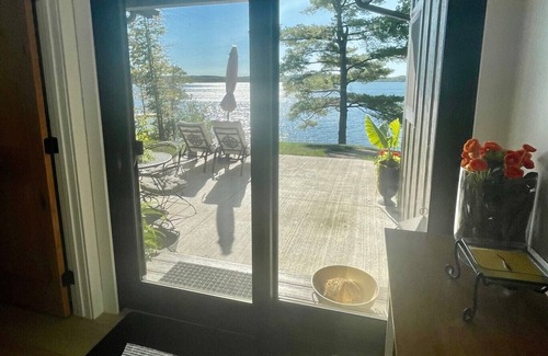 Aitkin House | New, stunning modern lake home with private swimming beach and dock