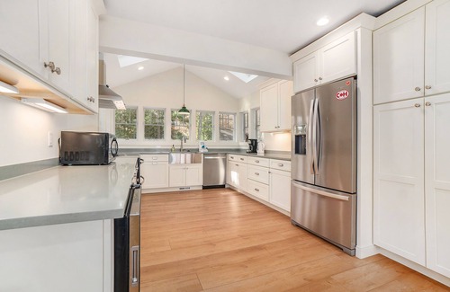 Lake Township House | Newly remodeled lake house with amazing views, dock, firepit & vibrant interior