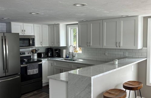 Fitzwilliam House | Newly renovated lake front home with dock and sunset views of Laurel Lake