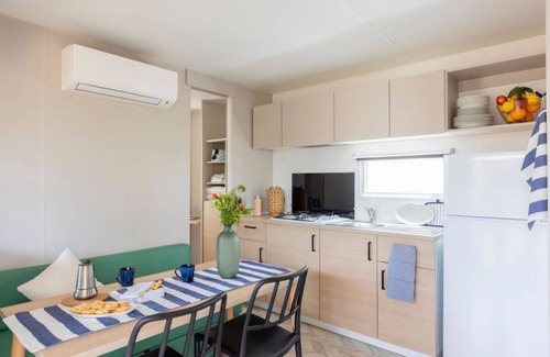 Marina di Montalto House | Nice and welcoming mobile home located near the beach with air conditioning of approximately 24 m2 composed of a living room, kitchenette with gas stove, fridge with freezer, pots and pans.A bedroom with a double bed and another bedroom with two single b