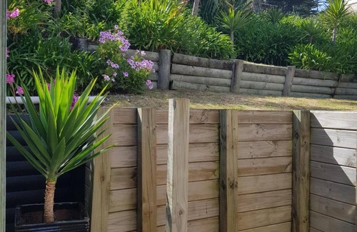 Waitarere Beach House | Now with unlimited fibre broadband! Warm,2 bedroom bach in quiet,sunny location.