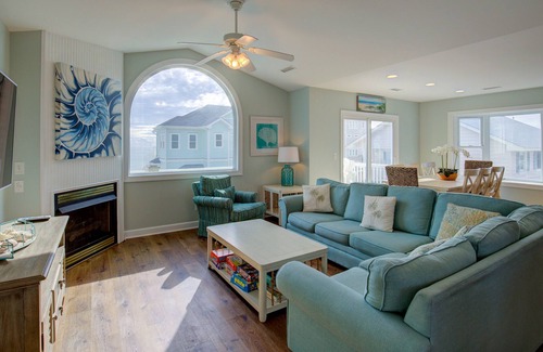 Village of Stump Sound House | Ocean-view 2-story home with fireplace, community outdoor pool & tennis court