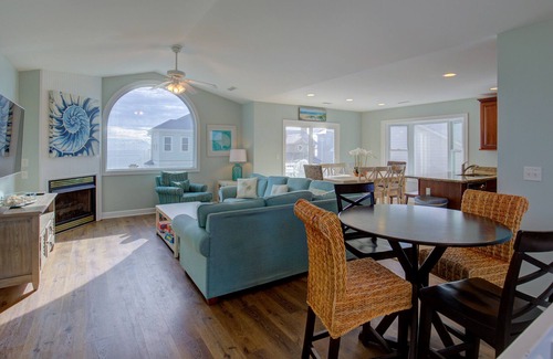 Village of Stump Sound House | Ocean-view 2-story home with fireplace, community outdoor pool & tennis court