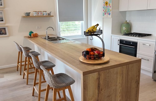 Sellicks Beach House | Ocean views, Sunset on the rear deck, Pet friendly.