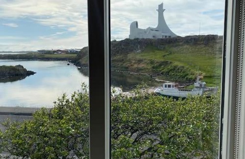 Stykkisholmur Villa | Oceanfront holiday home with outdoor hot tub.