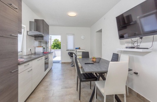 Polje Apartment | On the island of Krk welcomes you this beautiful apartment with shared pool.