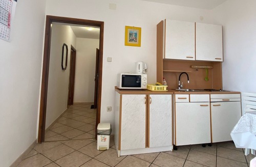 Lopar Apartment | One bedroom apartment with balcony and sea view Lopar, Rab (A-23747-c)