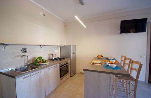 Procchio Apartment | Only 200 m from the main street of Procchio and 600 m from the fine sandy beach. It is located on the mezzanine floor with a separate entrance and a large covered terrace equipped with table and chairs for outdoor dining.
