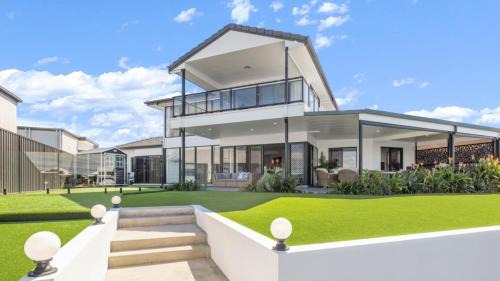 Banksia Beach House | Opulent Canal-Front Retreat