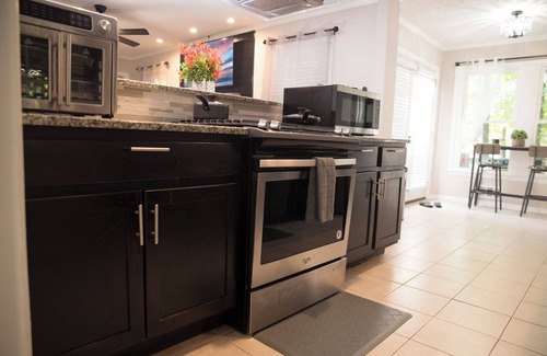 Sandtown House | Orange Oasis Villa Indoor Fireplace Garage Firepit BBQ grill near EVERYTHING!
