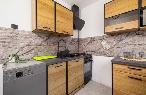 Katowice Apartment | Ossowskiego 28 Katowice | Blue and Green Apartment with Balcony