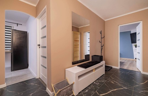 Katowice Apartment | Ossowskiego 28 Katowice | Blue and Green Apartment with Balcony