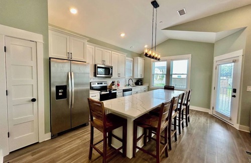 Corolla Condo | Oyster & Pearl Beautiful New Single Level Condo