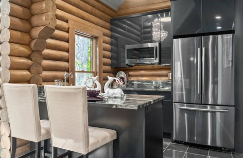 Logan Cabin | Paris Art Deco-Romanic-Opulent-Massage Chair-Sauna-Hot Tub-Kayaks-FireTable