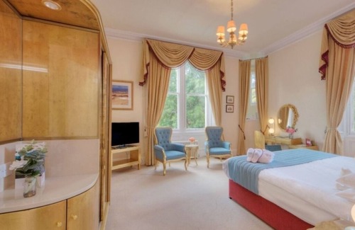Nairn Hotel | Peaceful Retreat in Inverness: Elegant Room Amidst Lush Historical Gardens
