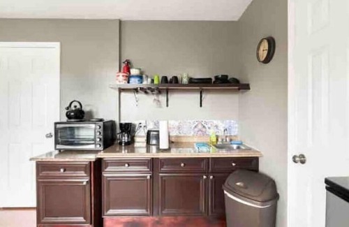 Northeast Pensacola Apartment | Pelican Nest-Charming Suite/Pool/Jacuzzi Tub/Private Balcony!