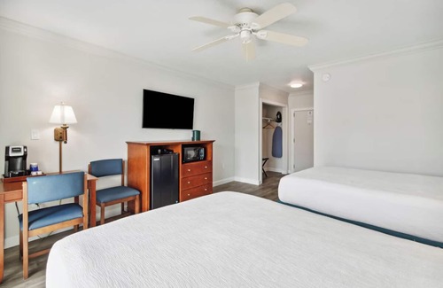 Neptune Beach Hotel | Perfect Beach Getaway: 4 Family Rooms, Outdoor Pool & Pet-Friendly