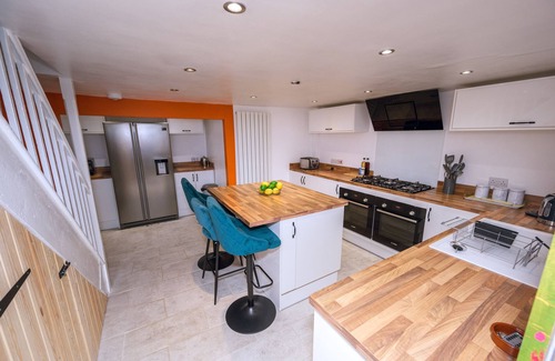 Port Talbot House | Pet-friendly accommodation with fenced garden 2 bedrooms, Secure bike shed .Cozy log burner Netflix