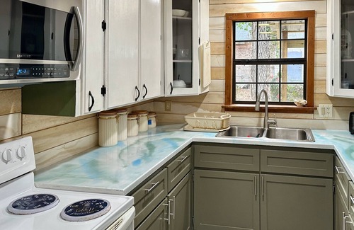 Ore City House | Pet-friendly campground cabin retreat w/shared pool, firepit, lake access