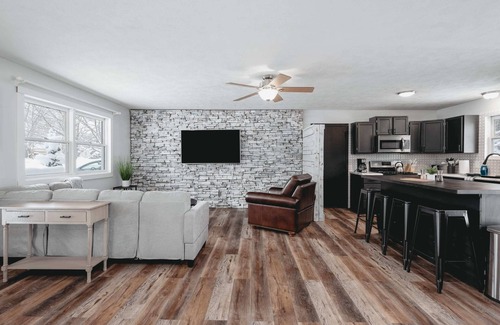 Grawn House | Pet-friendly home with fenced-in yard and hot tub