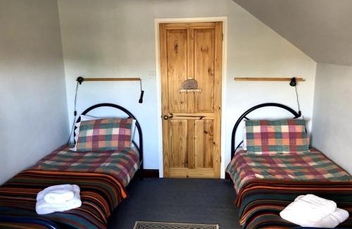 Stanhoe House | Pilgrims - Traditional flint cottage with open fire