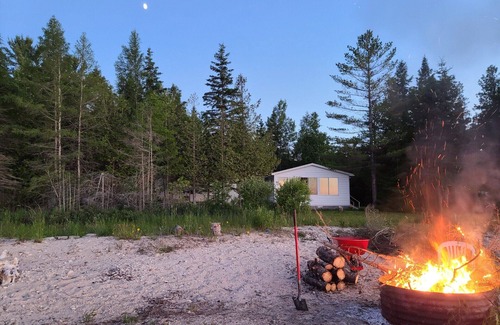 Carp Lake Cottage | Private and secluded lakefront 15 Minutes From Mackinaw City