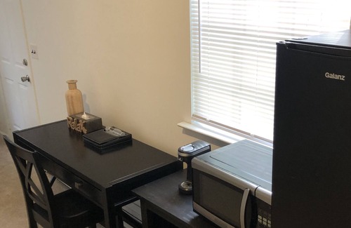 Dix Hills Apartment | Private bedroom & living rm/kitchenette w/ desk and use of pool