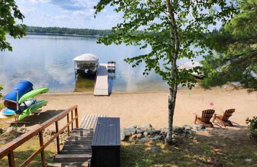 Nevis Cabin | Private lake cabin. WiFi, Beach, Pontoon Rental. Booking for summer of 26!