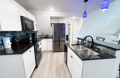 Sunrise Beach House | Private lakefront A-frame nestled in the forest on a quiet cove at Lake of the Ozarks. Sleeps 12 with 4 bedrooms, 2 baths, private dock, kayaks, coffee bar, and decks overlooking the water. Peaceful, scenic, and perfect for families or friends.