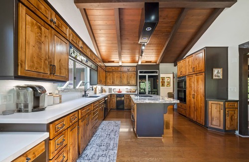 Oakhurst House | PRIVATE RESORT STYLE RIVERFRONT ESTATE W/TENNIS COURT, POOL, SPA, WATERFALLS.