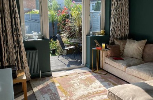 Bournemouth House | Private room, shared bathroom with one other, tea and coffee making facilities, mini fridge and hairdryer, King sized bed with help yourself continental breakfast in Secluded Modern Property with Parking