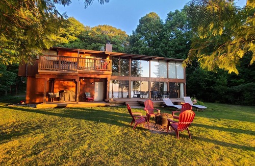 Suttons Bay House | Private Suttons Bay Waterfront Home with Hot Tub, Sauna and Central Air!