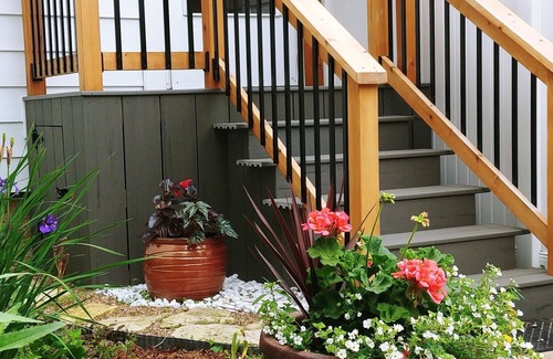 Emporia Apartment | Private Upper Deck surrounded by flower and vegetable gardens. Pet friendly