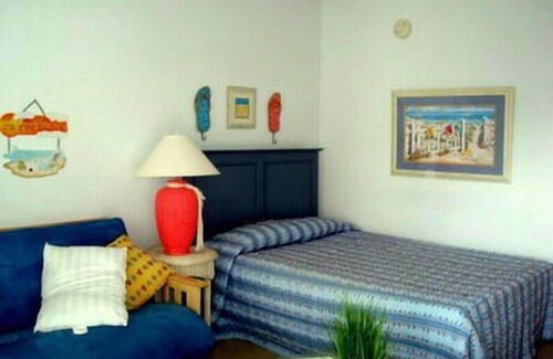 North End Condo | Professionally decorated with in ground pool. 1 1/2 blocks to the beach, boardwalk and shopping. Assigned off street parking!