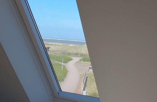 Baltrum Apartment | Quiet maisonette island apartment with 2 bedrooms, sea view and balcony