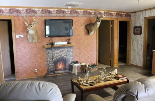 Thompsonville Cabin | Relax at Pond View Loft—your cozy barn-top retreat with pond views, fires, and fishing fun.