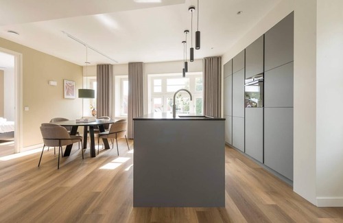 Oirschot Apartment | Relax in the invigorating shower and delight in the fully equipped kitchen.